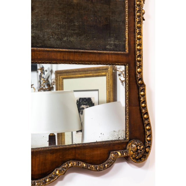 Absolutely grand, hand carved, veneered and gold gilded, late 18th century. Frame inset with both original, mercury glass,...