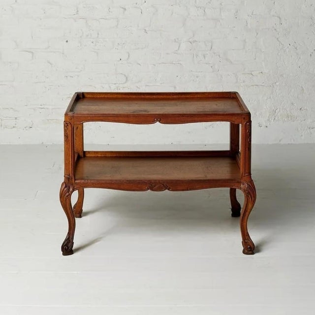 This 19th Century Belgian oak two-tier Chippendale table showcases elegant craftsmanship and timeless European...