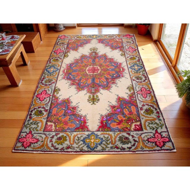 Add a touch of vintage charm to your home with this vibrant 1970 Hand Knotted Turkish Rug! Crafted from natural wool on...