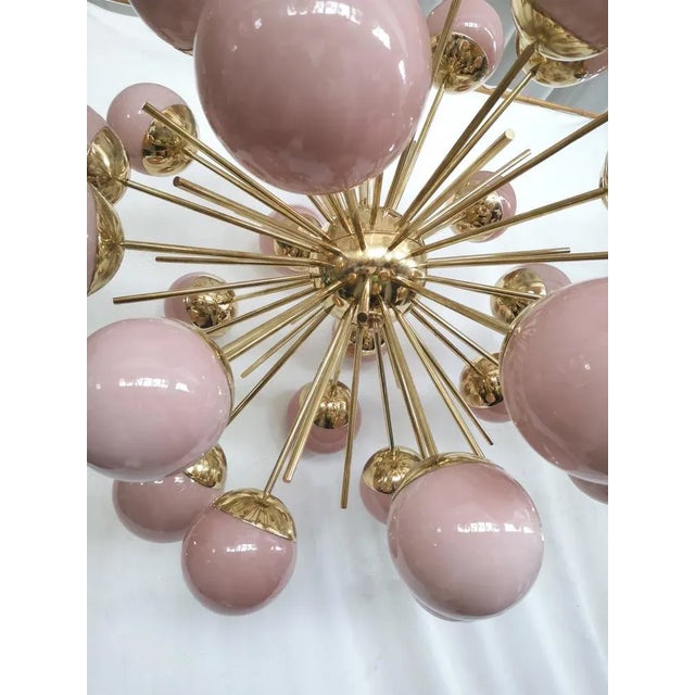 A fantastic spot of pink color, amazing design due to its very particular shape of these pink glass spheres and for the...