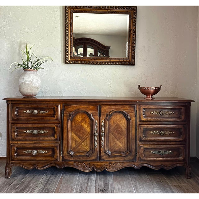 Beautiful vintage Drexel Heritage Cabernet triple dresser, model 308-134, dating to 1960. Features nine drawers, including...
