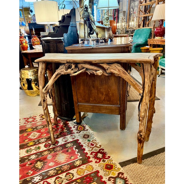 This is an unusual and charming rustic serpentine form console. Although very rustic in materials and construction, the...