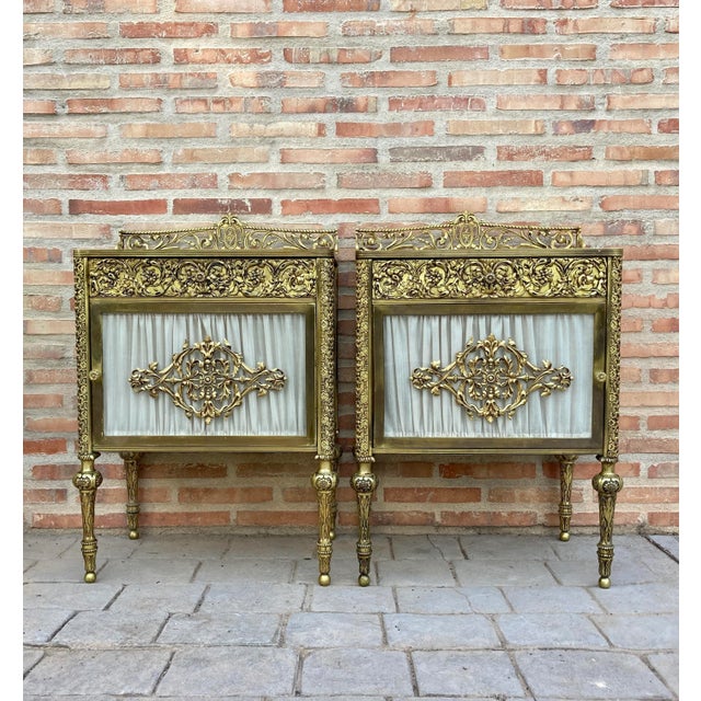 Pair of 19th century bronze and mirror bedside tables with a central brass drawer. These late 19th century Bronze and...