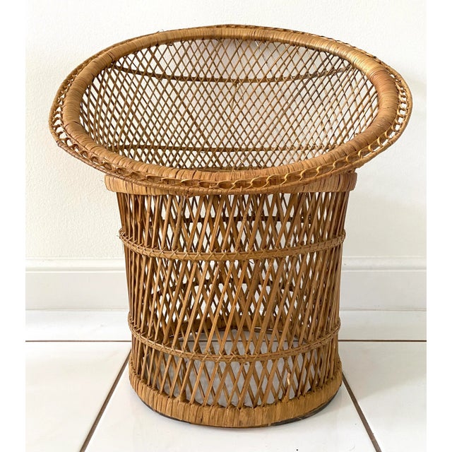 Vintage wicker and rattan barrel back chair or can also be used as a plant stand. Very sturdy and all rattan is intact in...