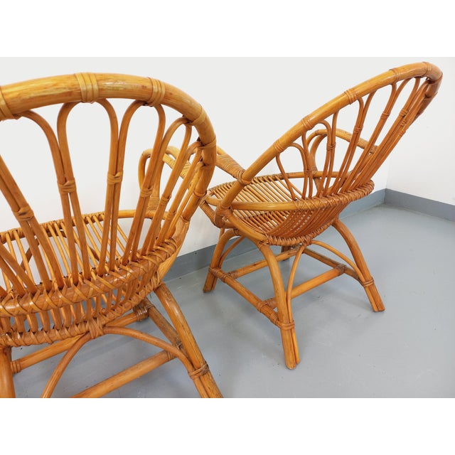 Set of 2 vintage armchairs from the 60s, in rattan, very beautiful design, very good general condition with patina of time...