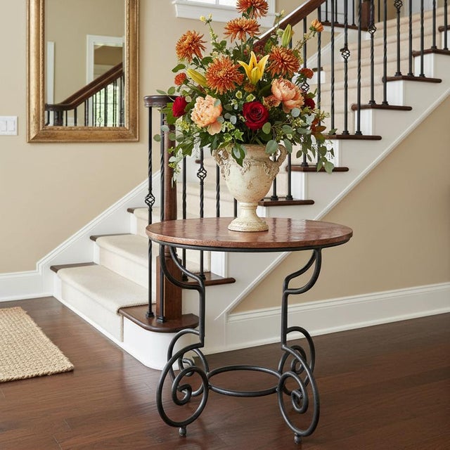 Dimensions: 32.5" W x 32.5" D x 31" H This is stylish mixed media round table. Hand forged scrolled wrought iron base...