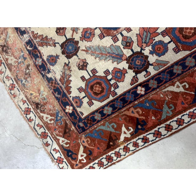 Very old handmade antique North-West Persian rug in white and red background colors. The rug is from the beginning of 19th...