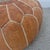 Vintage light tan leather pouffe /seat /foot stool light coloured stitching with a motif on the top 52cm diameter 30cm...