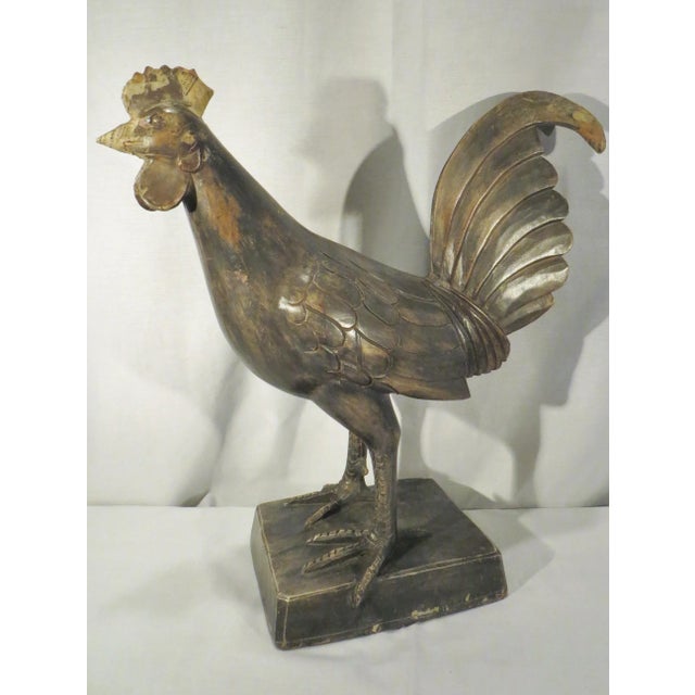 A large wood carved paper mache mold in the shape of a rooster. It is rare in the sense that it is large scale and also a...