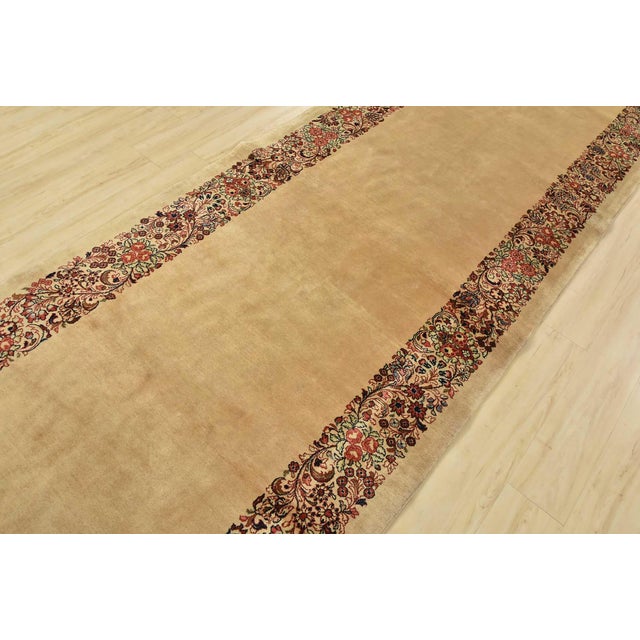 An authentic vintage traditional Sarouk runner hand-knotted with fine wool and natural dyes. This intricately woven rug...
