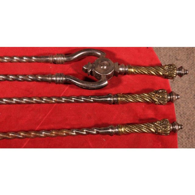 Superb set of 3 fireplace accessories including: 1 pestle 1 shovel with openwork decoration 1 articulated tong This set...