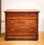 An Eastlake era dresser from the late 1800s with delicate carvings and original hardware.