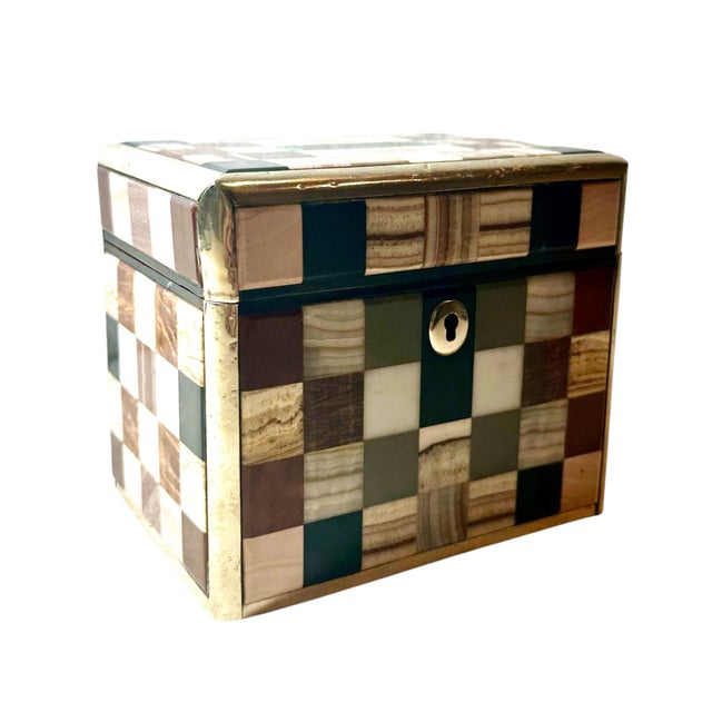 A wonderful, continental small humidor out of specimen marble. It has the original key. Humidor is trimmed with silver...