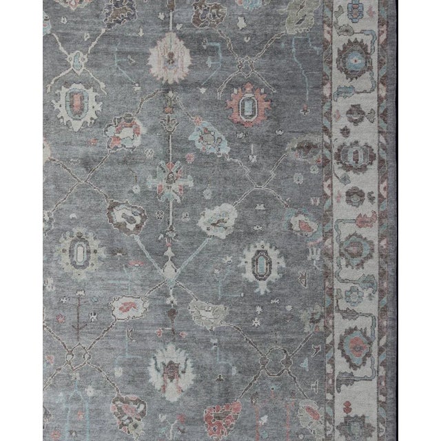 Turkish Oushak rug with gray, pink, neutral color palette and all-over flower design, rug en-179699, country of origin /...