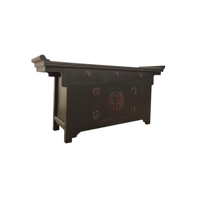 This late 19th century coffer-style elm sideboard is crafted from solid elm wood. The top features traditional upturned,...