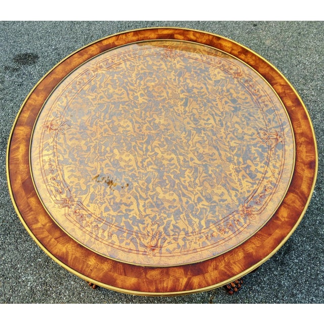 Spectacular Large Center Table by Theodore Alexander - from rare EGLOMISE Collection. It is made of carved wood and...