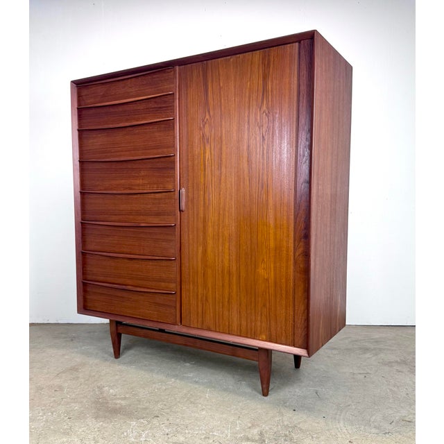 A gorgeous mid century Danish modern tall dresser / armoire designed by Svend Aage Madsen for Falster a Mobelfabrik,...
