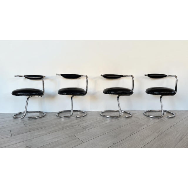 Set of four cobra chairs (+ 1 free), designed by giotto stoppino and dating back to the 1970s. chromed tubular metal...