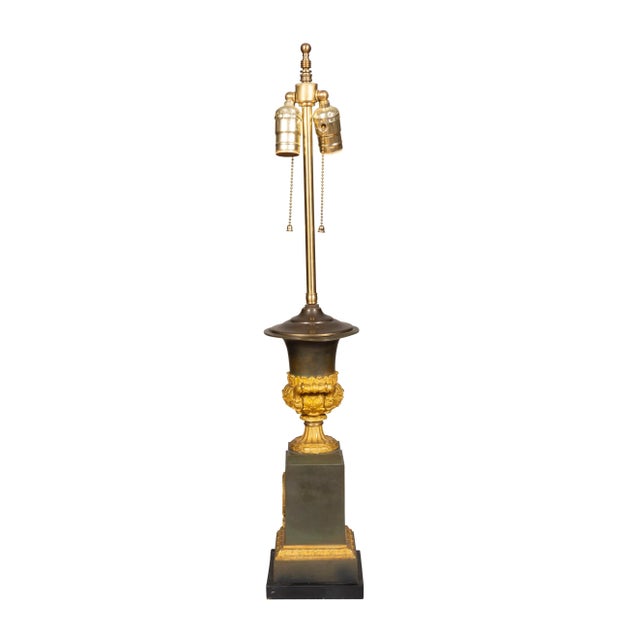 Two light . Converted from a pair of urns. Classical campagna form with square wreath mounted plinths.