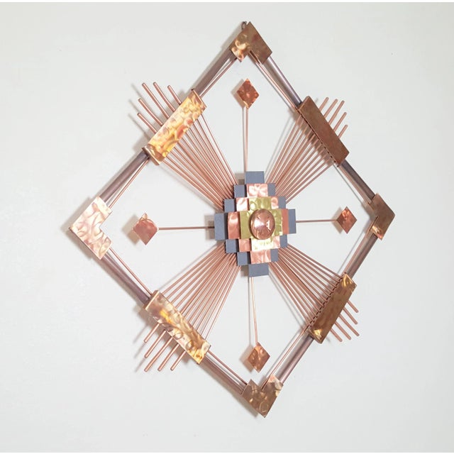 This a very nice wall art. Made out if cooper. Very nice look and shape. Very good condition