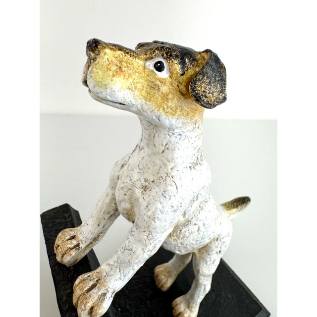 A playful yet substantial accent, this pair of vintage cast iron bookends features dogs captured mid-pose, paws perched...