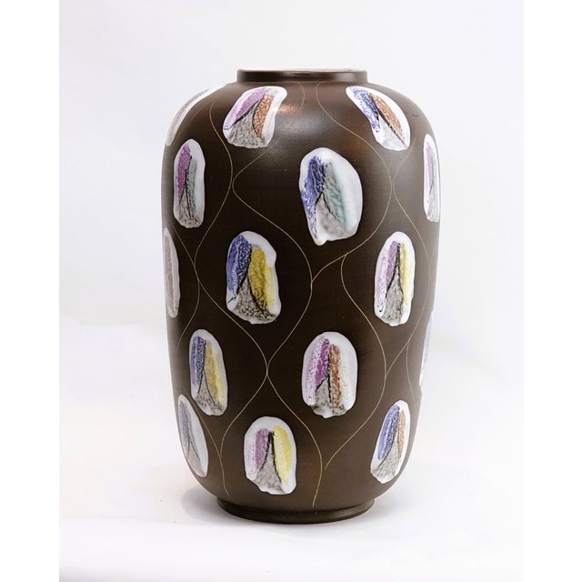 An exceptionally beautiful floor vase in the rare and coveted "Kongo" decor, designed by Bodo Mans for Bay Keramik, West...