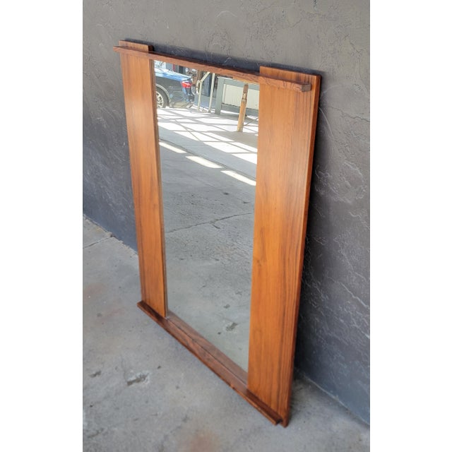 Scandinavian Modern rectangular rosewood wall mirror with Andr. L. Riss paper label. Norway, circa. 1960's. Andr. L. Riss...