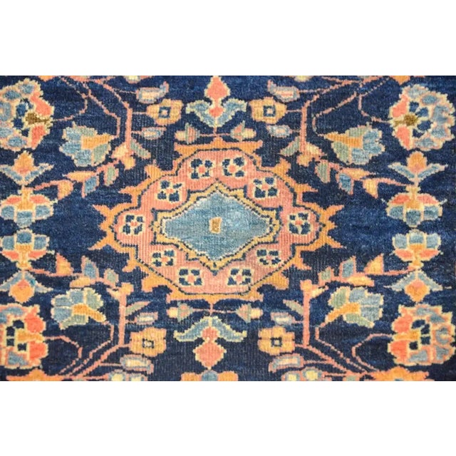 A fantastic 19th century Persian Sarouk Mohajeran rug with a traditional pattern consisting of a mirrored floral pattern...