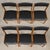 A set of six mid century modern solid teak dining chairs with black vinyl back rests and seats. Seat height is 17.5”. Made...