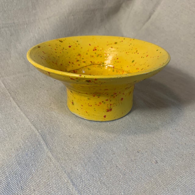 Mustard yellow speckled with red and green-set of 3. Largest bowl with a pedestal and two smaller ones. Perfect for...