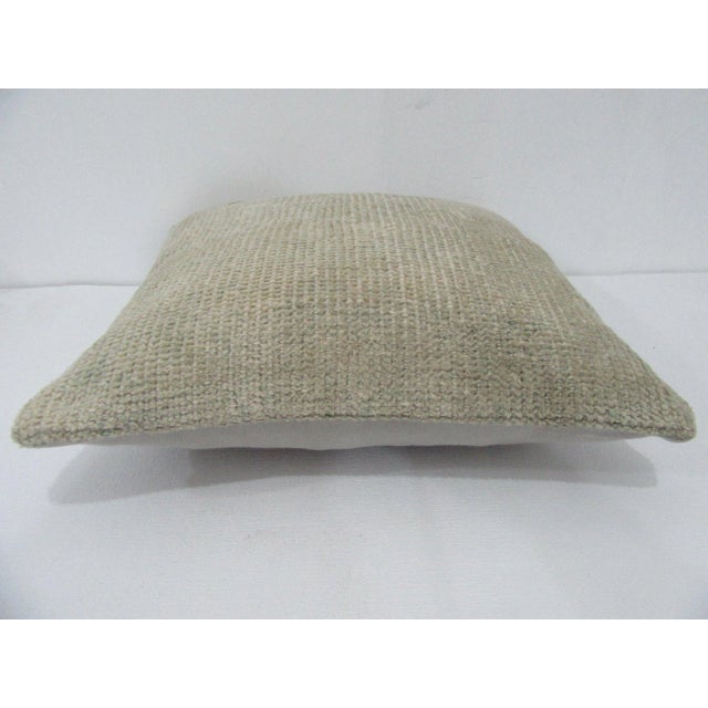 Decorative pillow cover made from a vintage Turkish handknotted rug. Backed with good quality cotton fabric. Pillow...