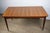 Charming Scandinavian teak dining table from the 1960s, with a simple and timeless design. Its rectangular top showcases a...