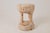 Carved from a single solid log, this side table has a pale, bleached quality that gives it a completely different feeling...