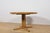 This round extendable dining table was manufactured by the renowned Danish furniture maker Farstrup Møbler in the 1970s....