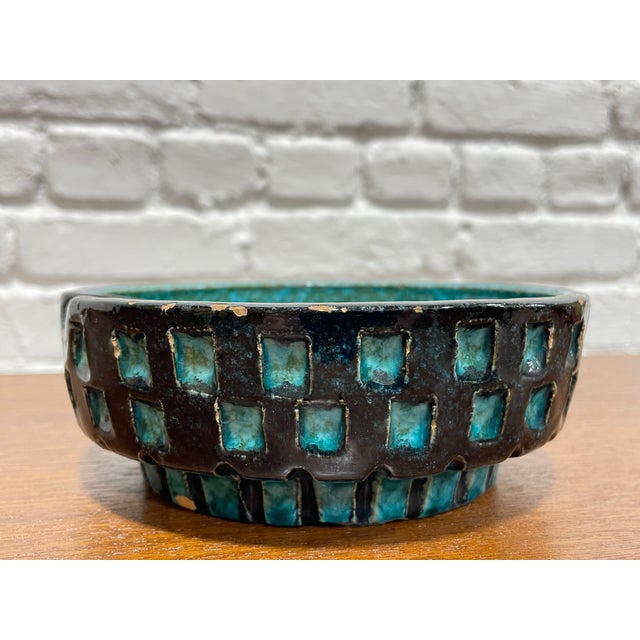 Vintage Italian Ceramic Bowl / Ashtray by Bitossi from the Mid Century Rimini Blu era, featuring Aldo Londi's signature...