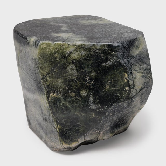 This low stone table is shaped from a captivating material known as greenery stone, named for its naturally occurring...