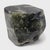 This low stone table is shaped from a captivating material known as greenery stone, named for its naturally occurring...