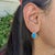 Fall for these serene robin’s-egg blue Sleeping Beauty Turquoise drop earrings, set in solid 14K Yellow Gold. Each earring...