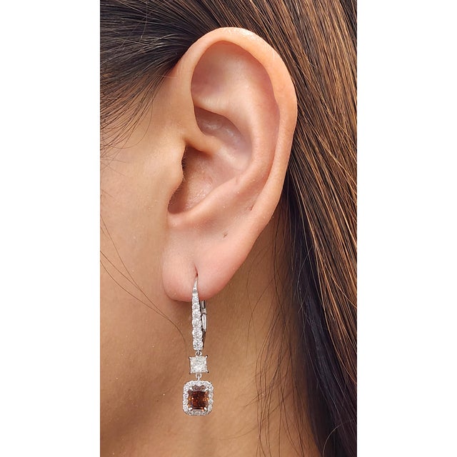 These stunning earrings feature two natural GIA-certified fancy deep orange-brown diamonds with a combined weight of 2.02...