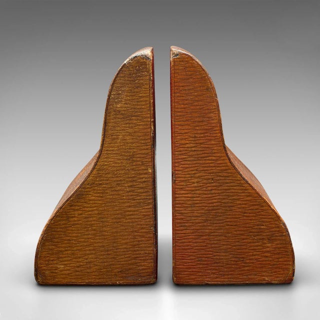 This is a pair of antique decorative bookends. An English, leather dressed book rest, dating to the Edwardian period,...