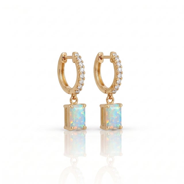 Elevate your daily ensemble with these breathtaking drop huggie hoop earrings featuring a sparkling pavé-set hoop and a...