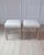 A refined pair of Swedish stools dating to the 18th century, executed in the elegant Gustavian style. Their clean...