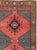 This Mid-20th century Turkish Anatolian room-size carpet presents a bold twin-panel composition arranged across coral-red...