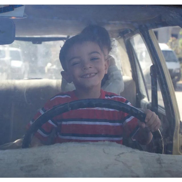 Copts 06 - signed limited edition archival pigment print, 2012 - edition of 5 little girl at the entrance of a store, in...