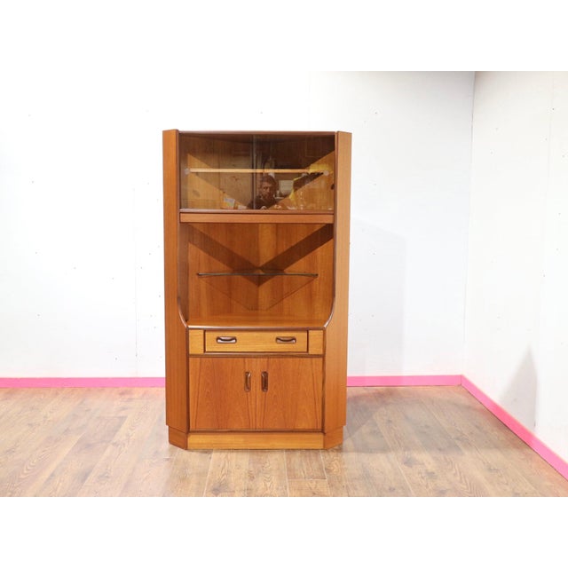 Beautifully crafted by renowned furniture maker G PLan this Mid Century Modern Vintage Teak Corner Display Cabinet by...