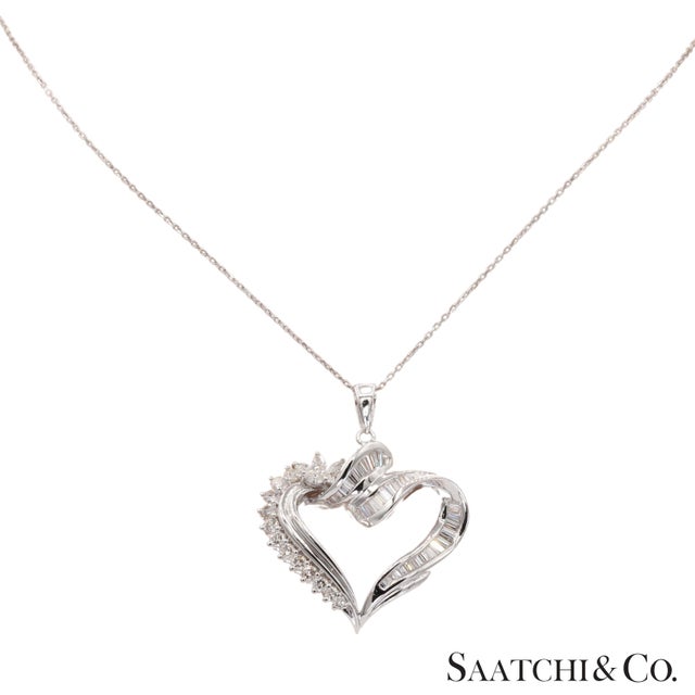Natural Diamond Heart Necklace Metal Type: 18K (750) White Gold Total Item Weight: 11.5 Grams Length: 18 Inch 1: Natural...