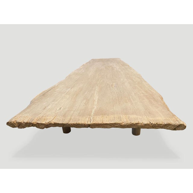 Impressive single slab, live edge bleached teak coffee table or bench with natural erosion on one end. We have added a...