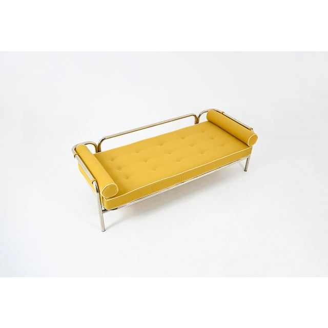 Daybed, chaise longue with yellow fabric cushion and white stitching, and metal frame made by Gae Aulenti. Model: Locus...