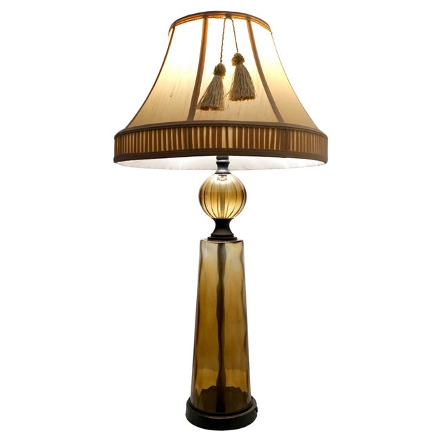 This is a beautiful "Gretel Lamp" that is made of amber glass with a gorgeous detailed pleated shade with a tassel. The...
