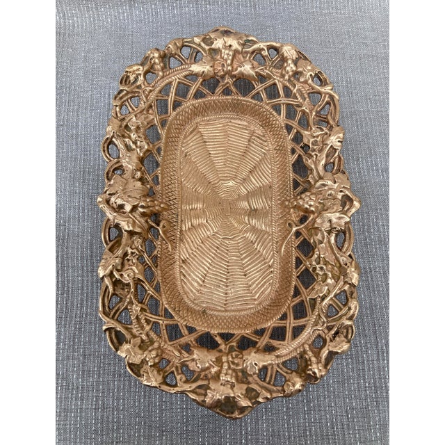 Heavy antique polished reticulated bronze dish, basket with an ornate grape design. Signed. Basket measures 9 1/4" by 6"...